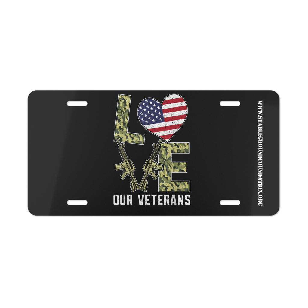 Love Our Veterans – Patriotic License Plate with Rifles and Camo Design