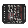 Mouse pad design featuring text 22 A Day Is 22 Too Many with military helmet, boots, and dog tags against a distressed American flag background.