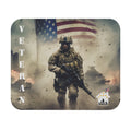 Mouse pad featuring U.S. soldier walking through battlefield with American flag and tanks in the background, honoring veterans.