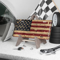 Distressed American flag license plate with rustic, weathered patriotic design.
