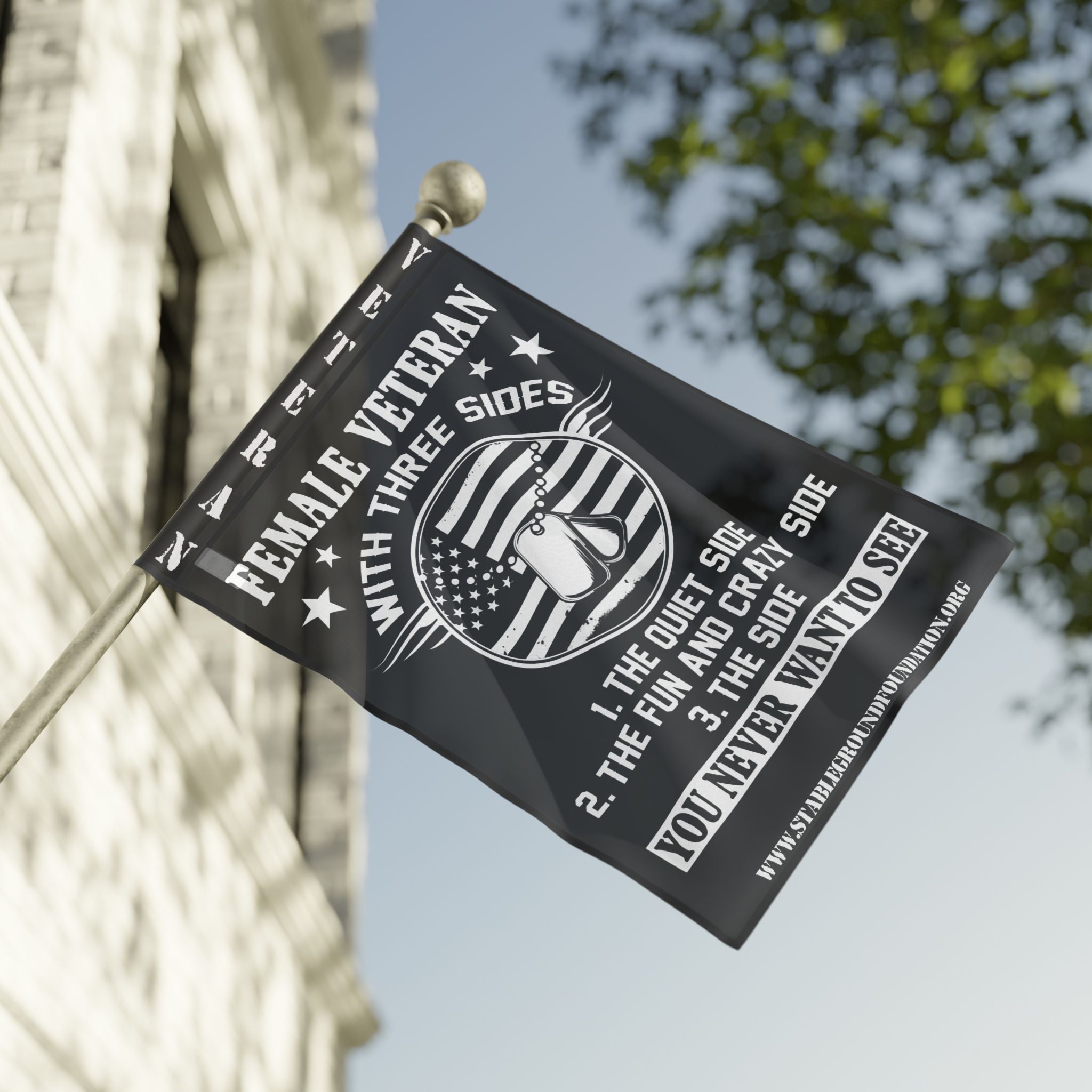 A black patriotic flag featuring dog tags and American flag art with the humorous quote “Female Veteran with Three Sides,” celebrating strength, humor, and service.