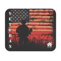 Mouse pad featuring silhouette of soldier standing before a distressed red American flag background symbolizing veteran pride.