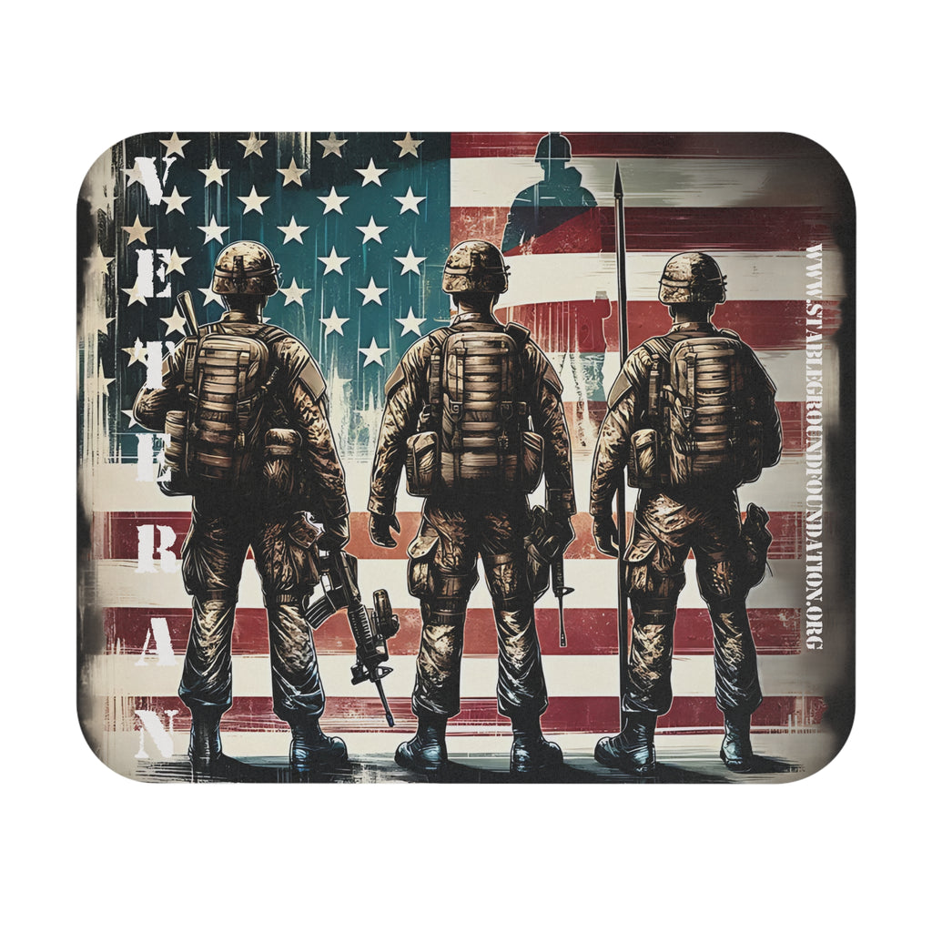 Mouse pad with three soldiers standing before an American flag and the word Veteran printed vertically on the left side.