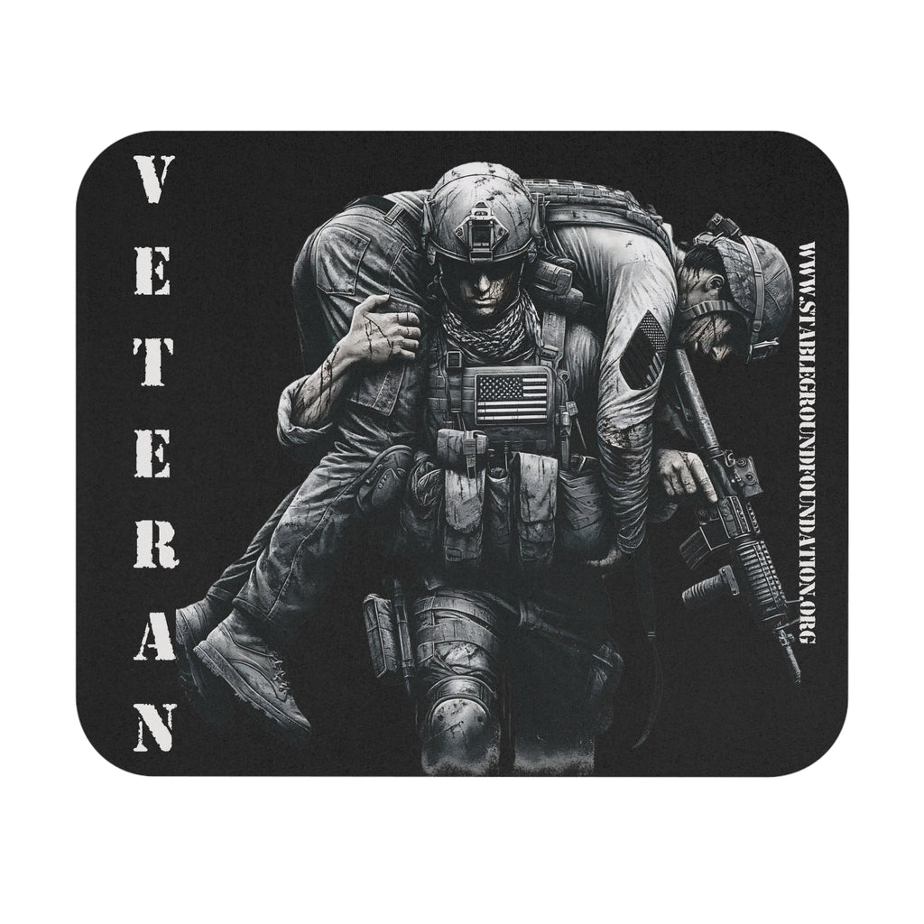 Black mouse pad with soldier carrying wounded comrade and the word Veteran printed vertically on the side.