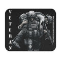 Black mouse pad with soldier carrying wounded comrade and the word Veteran printed vertically on the side.