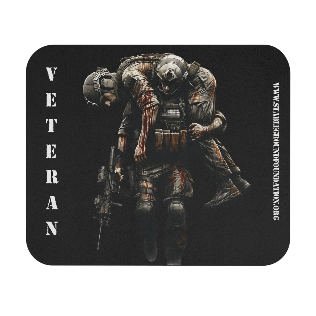 Mouse pad showing a soldier carrying his wounded comrade with the word Veteran printed vertically beside them.